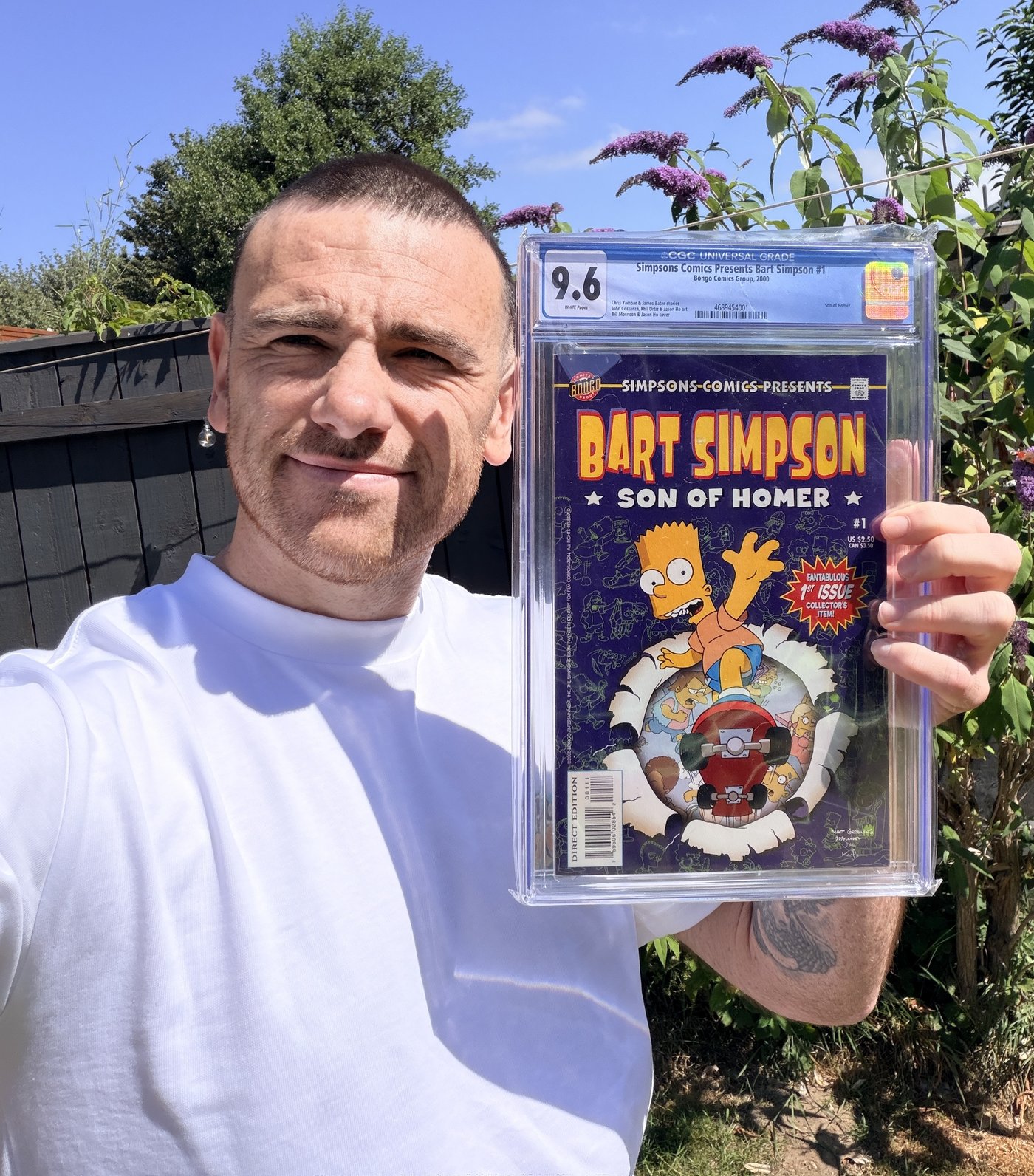 Lee from Retro Relics Comics holding Simpsons Comics Presents Bart Simpson #1, Son of Homer, cover art featuring Bart bursting through a skateboard ramp